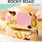 Pieces of white chocolate rocky road on a white plate.