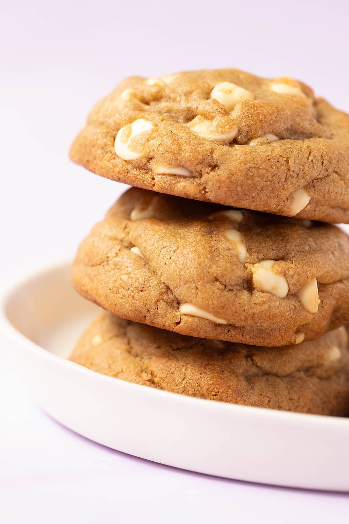 A stack of thick Gingerbread Cookies on a white plate. 