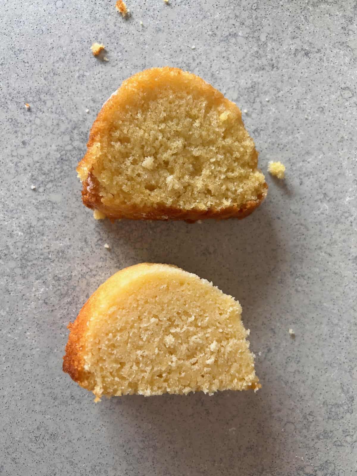 Two slices of lemon bundt cake taken during the recipe testing process. 