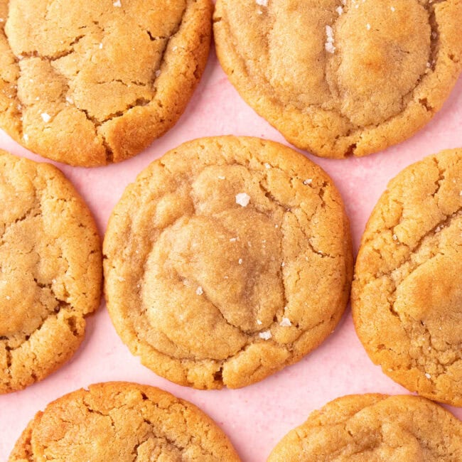 Peanut butter miso cookies on a pink backdrop