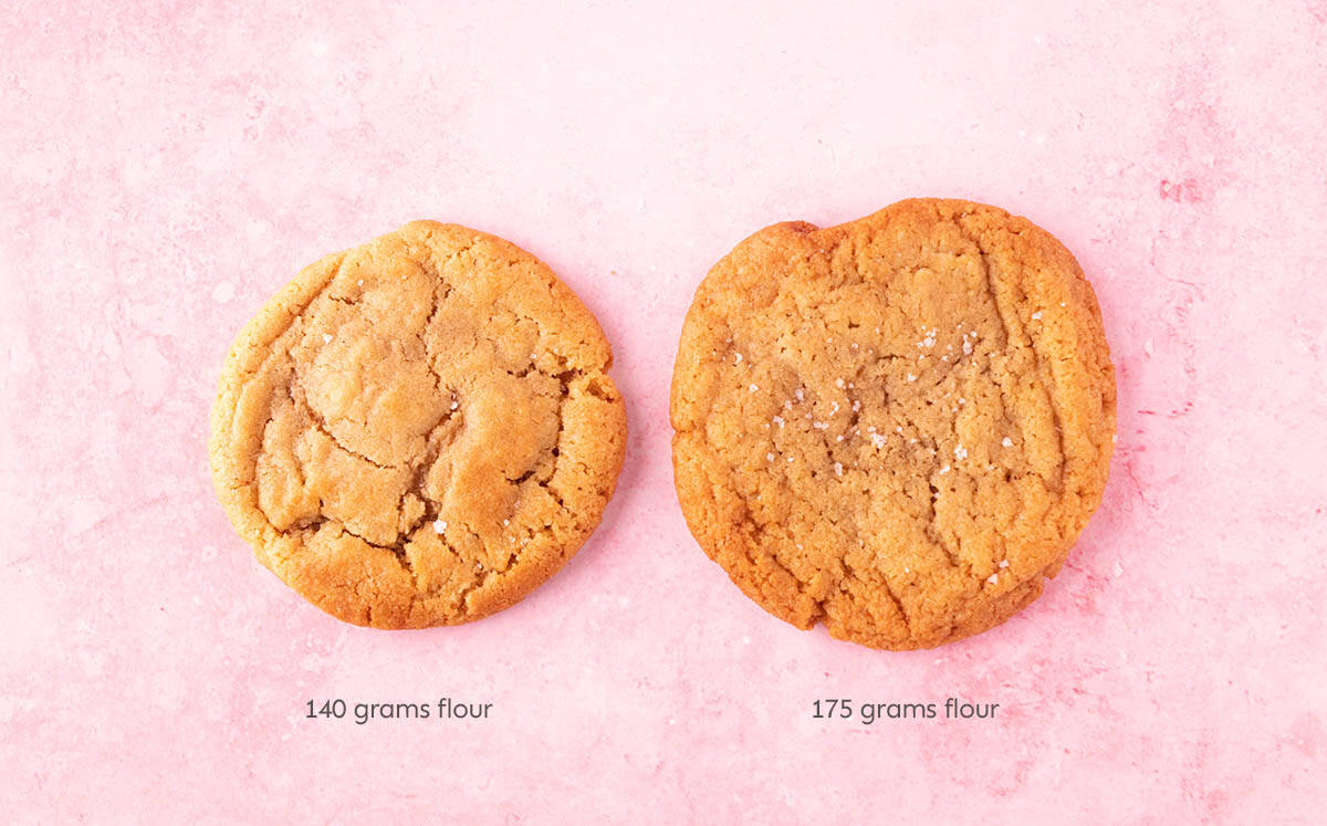 Two Peanut Butter Miso Cookies sitting side by side - one with slightly less flour. 