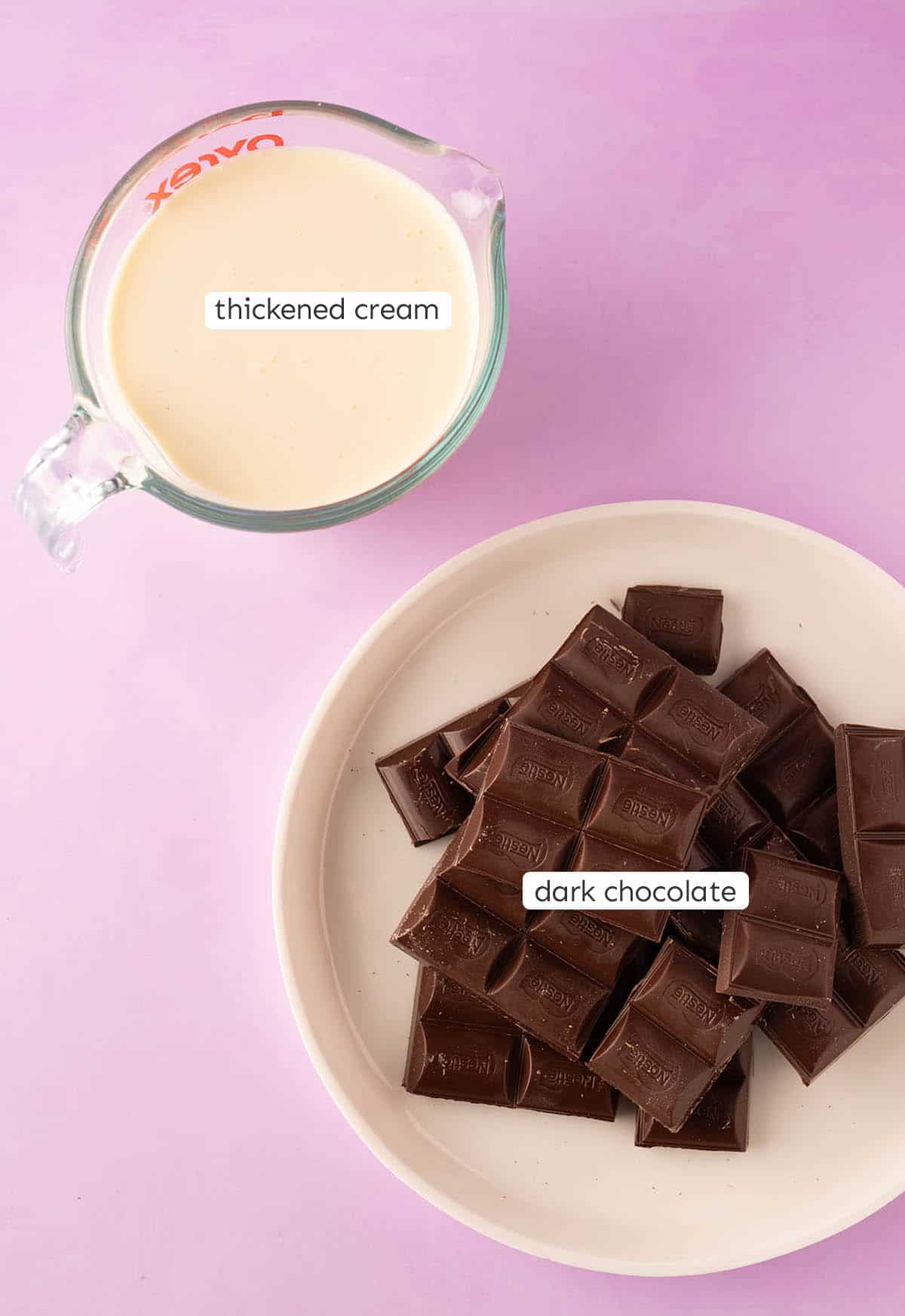 Two ingredients cream and chocolate on a purple backdrop.