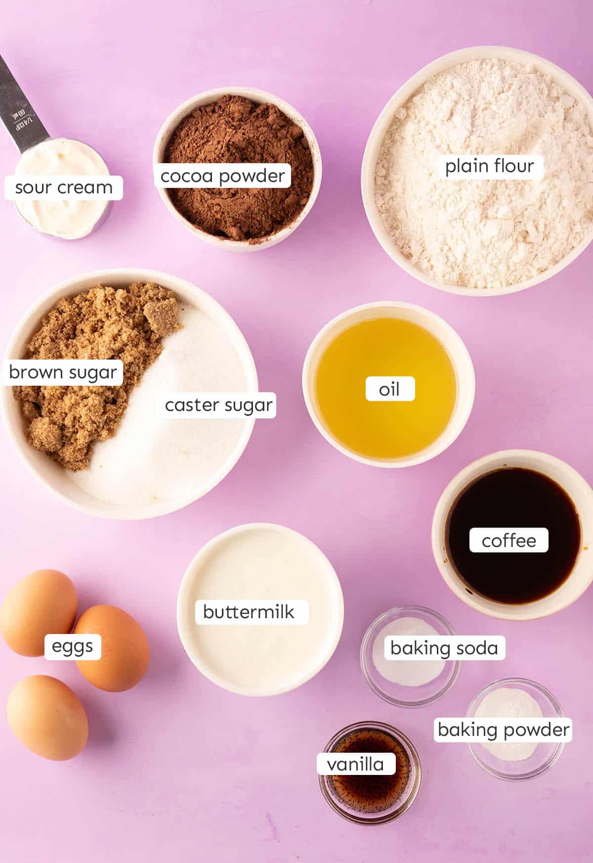 All the ingredients needed to make a moist chocolate layer cake from scratch.