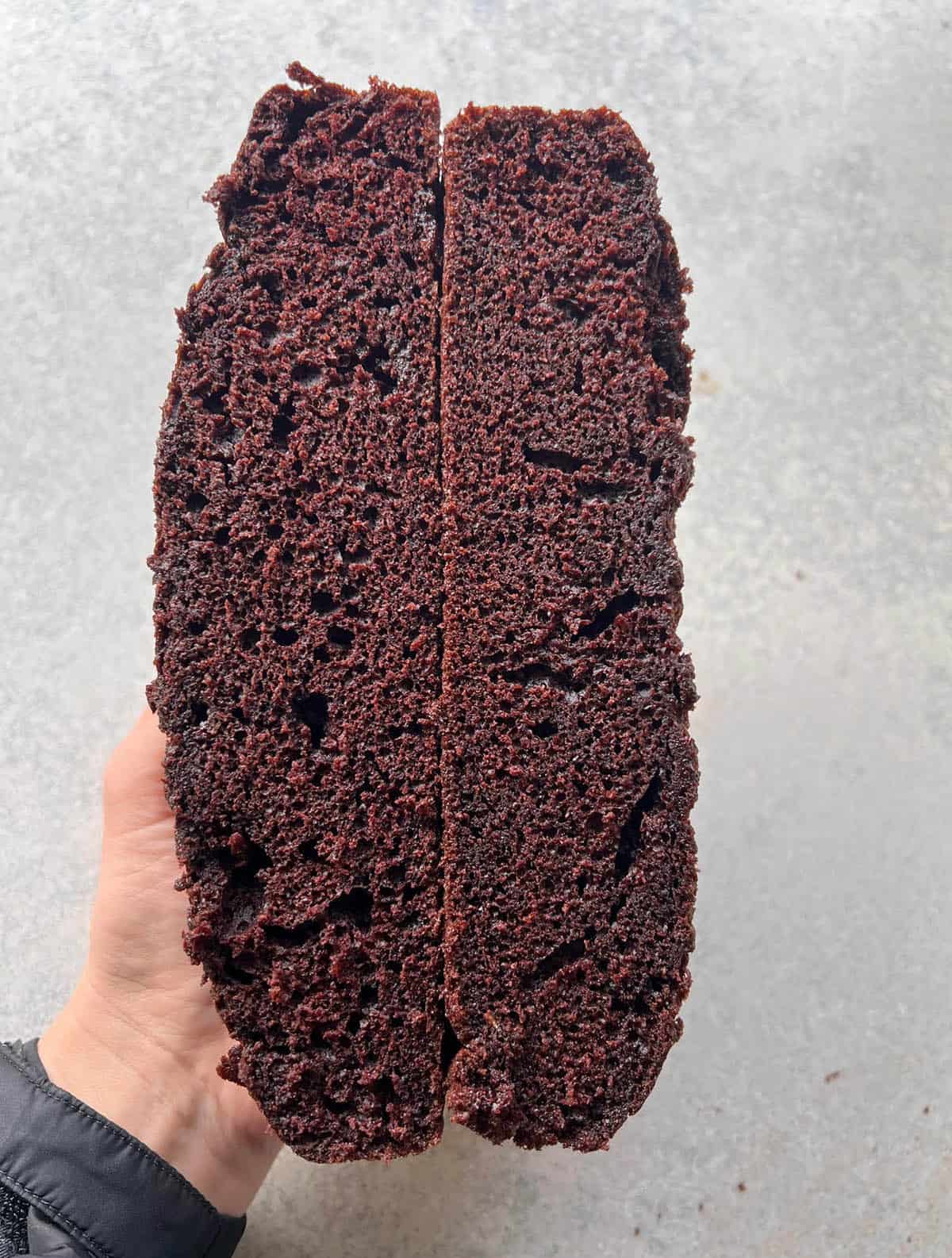 Two side by side chocolate cakes showing the recipe testing process.