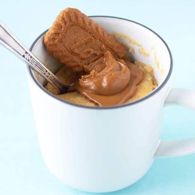 A beautiful Biscoff Mug Cake in a white mug.