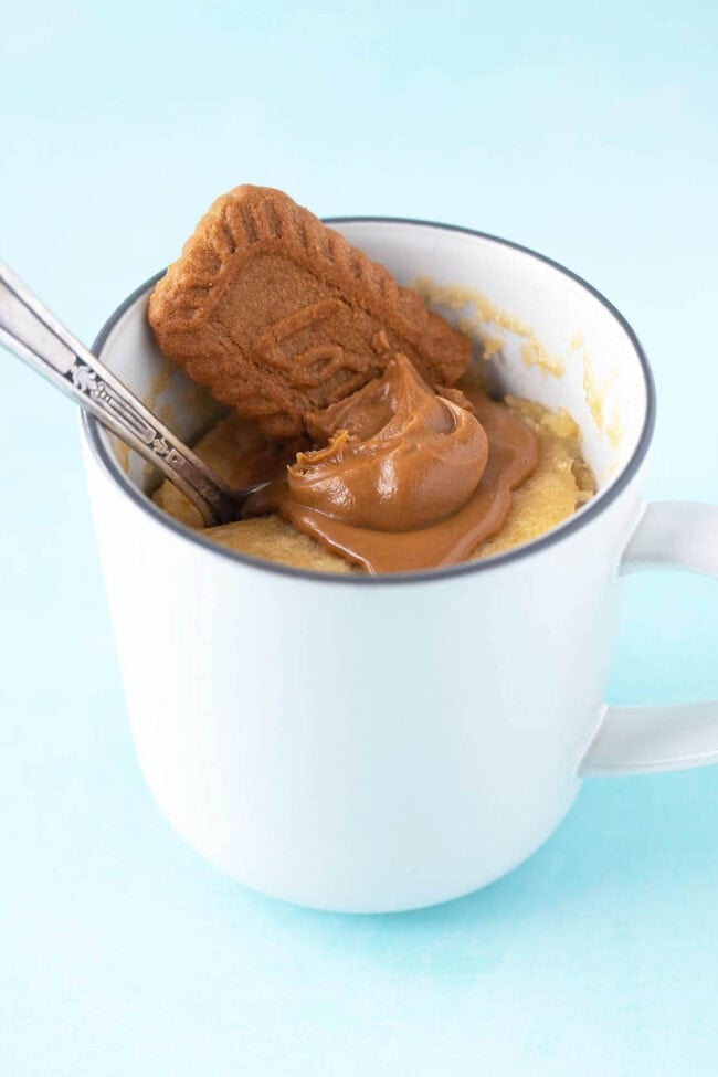 A beautiful Biscoff Mug Cake in a white mug.