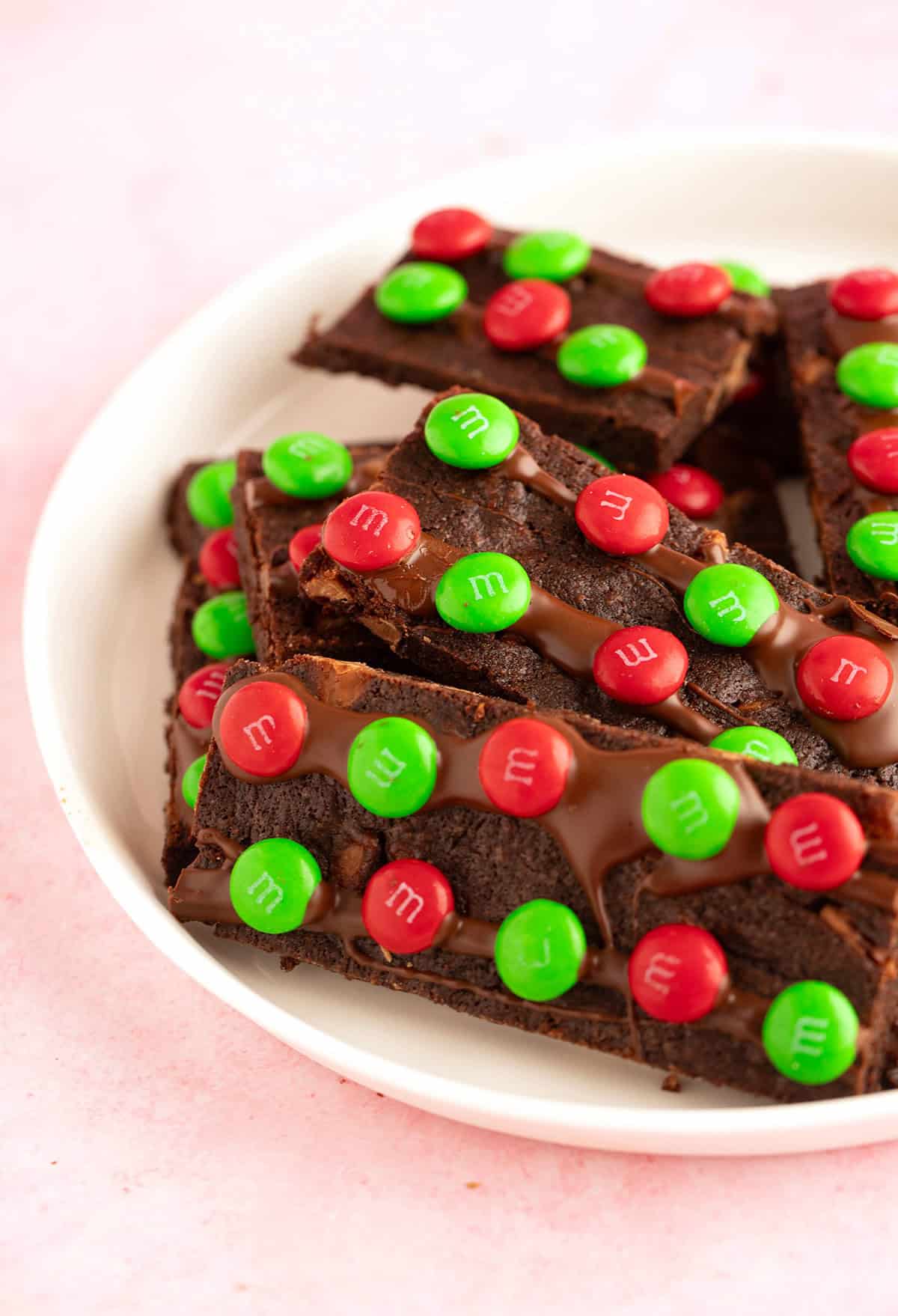 A plate of Christmas Brownie Bark adorned with M&M's.