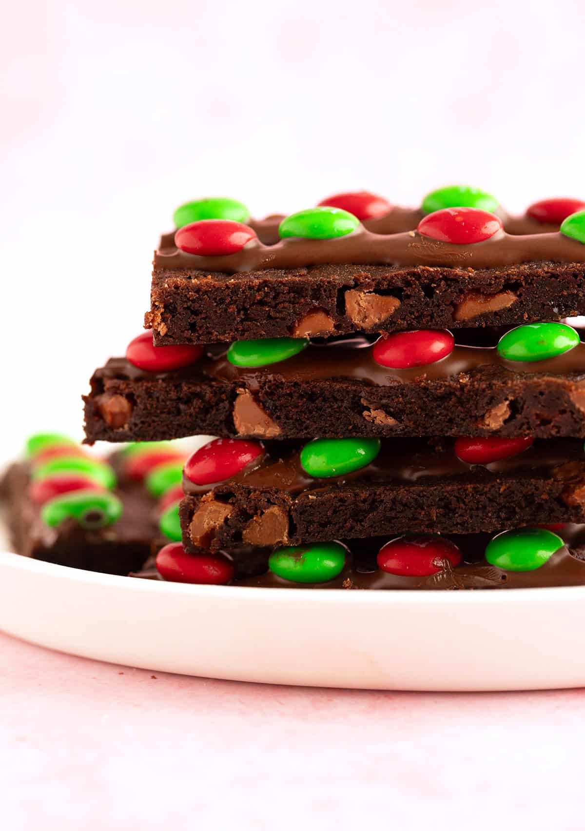 A stack of homemade brownie brittle on a white plate. 