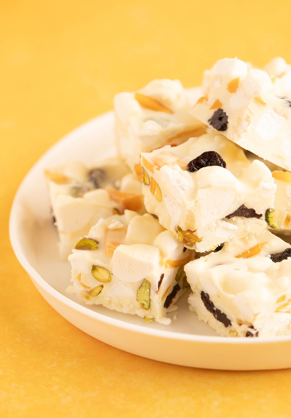 A white plate full of Pavlova Rocky Road. 