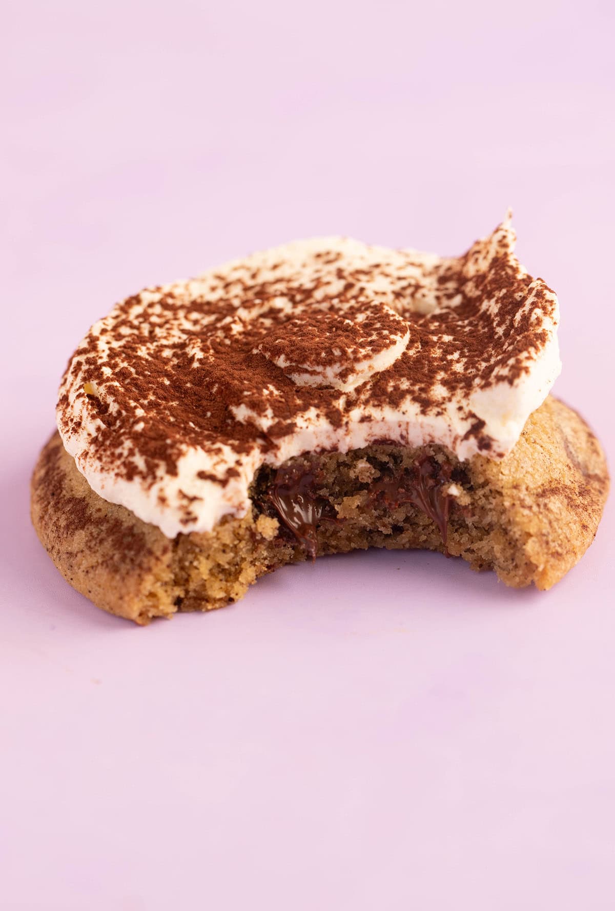 Close up of a Tiramisu Cookie with a bite taken out of it.