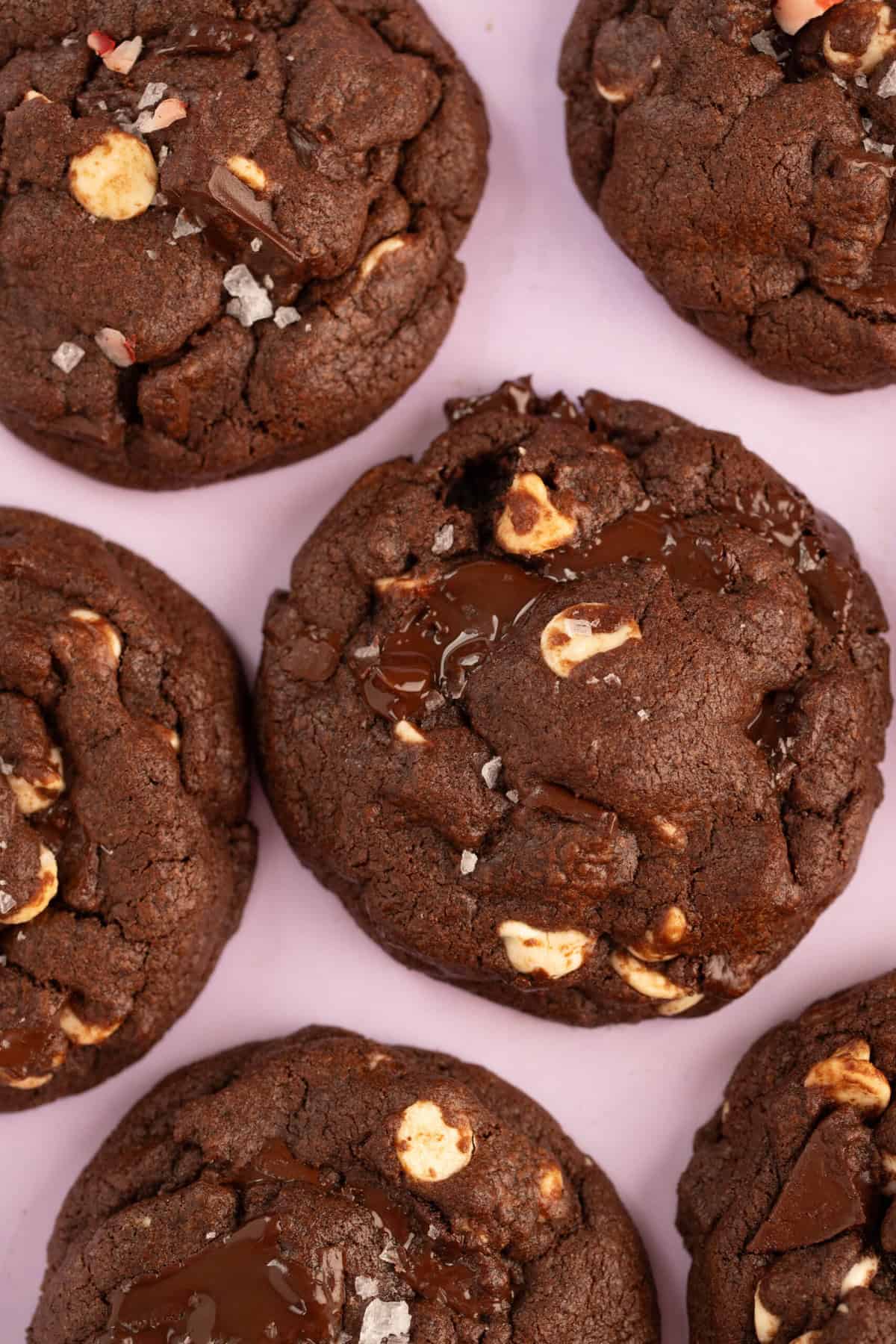 Close up of gooey chocolate mint cookies with gooey pockets of chocolate.