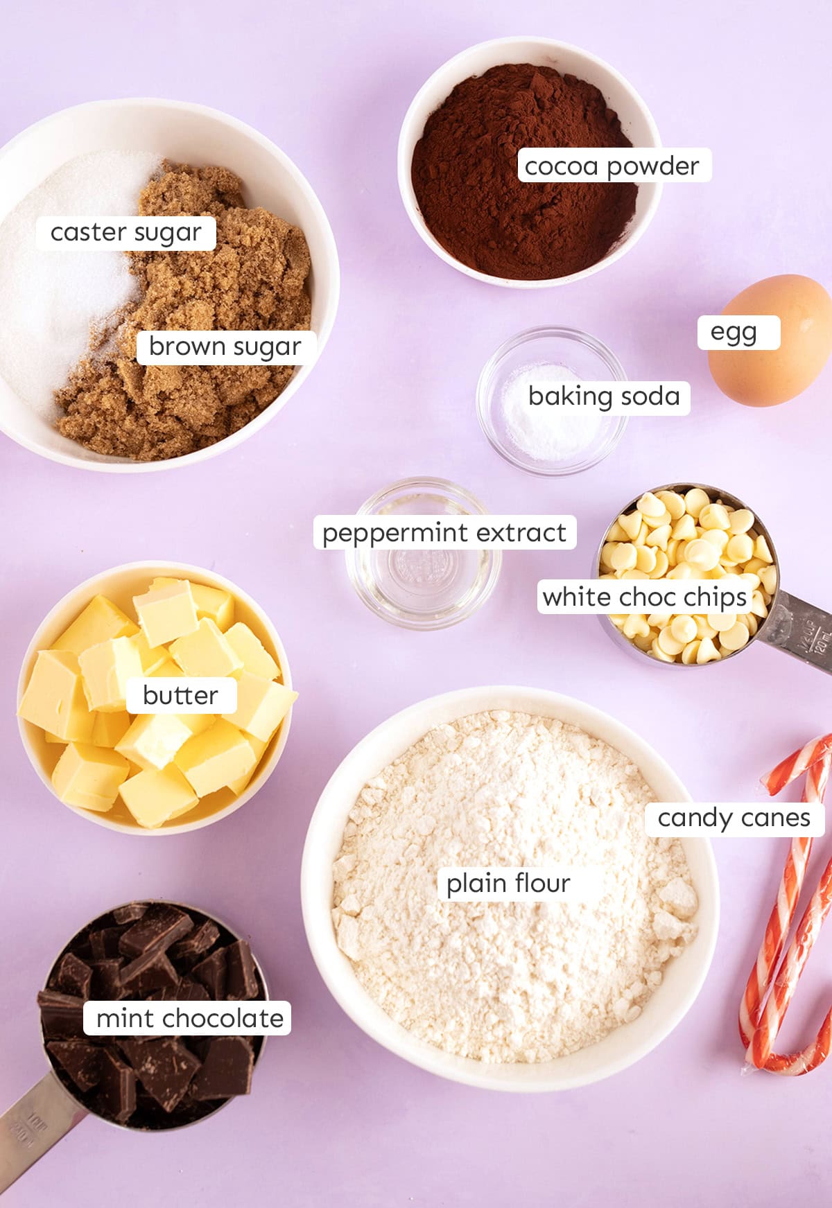 All the ingredients needed to make peppermint cookies on a purple backdrop.