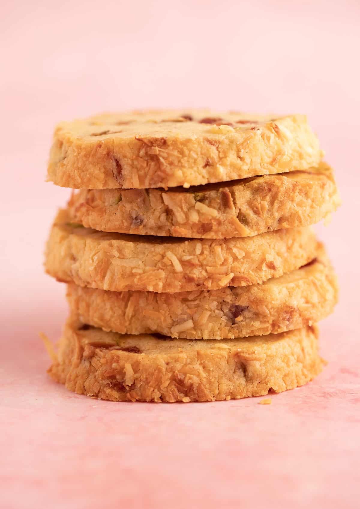 A stack of golden Christmas slice and bake cookies. 