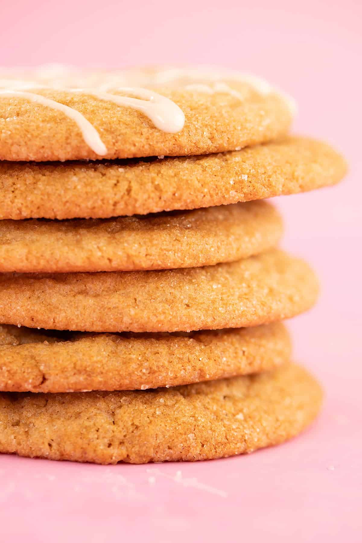 A stack of chewy gingerbread cookies show their crispy edges.