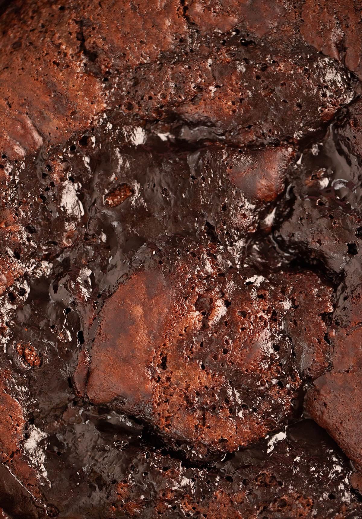 Close up of the gooey top of a chocolate self-saucing pudding.