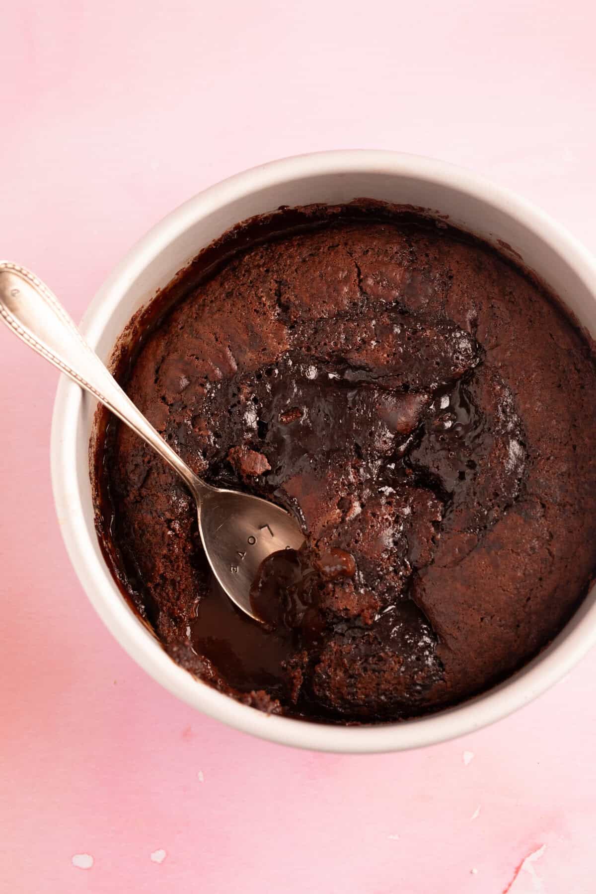 Top view of a chocolate orange self-saucing pudding straight out of the oven.