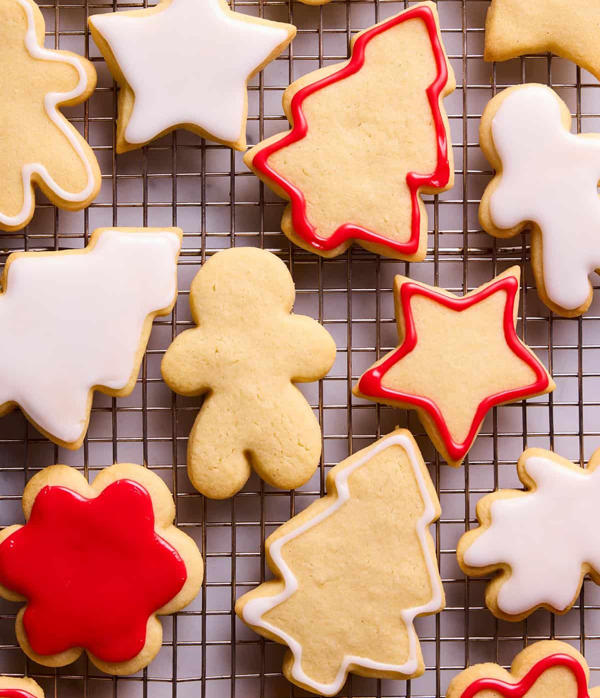 Beautiful sugar cookies decorated in white and red by Jessica Holmes